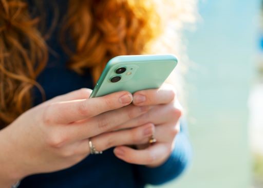 Close up of woman using smart phone